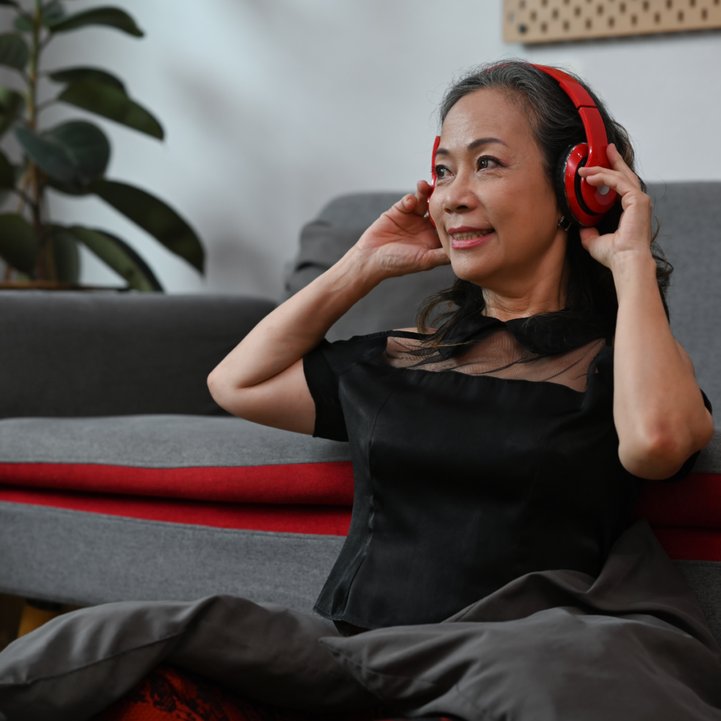 woman at home wearing headphones